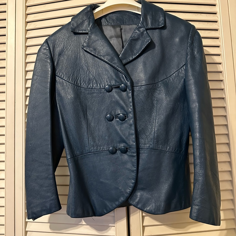 Small vintage leather jacket. Blue with a hint of turquoise. In excellent shape.
